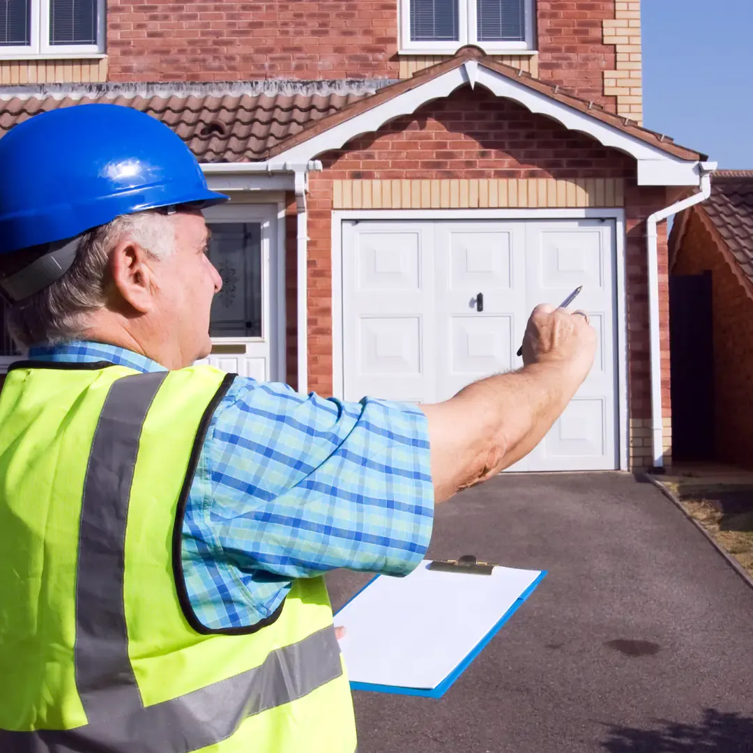 property surveyor examining UK home