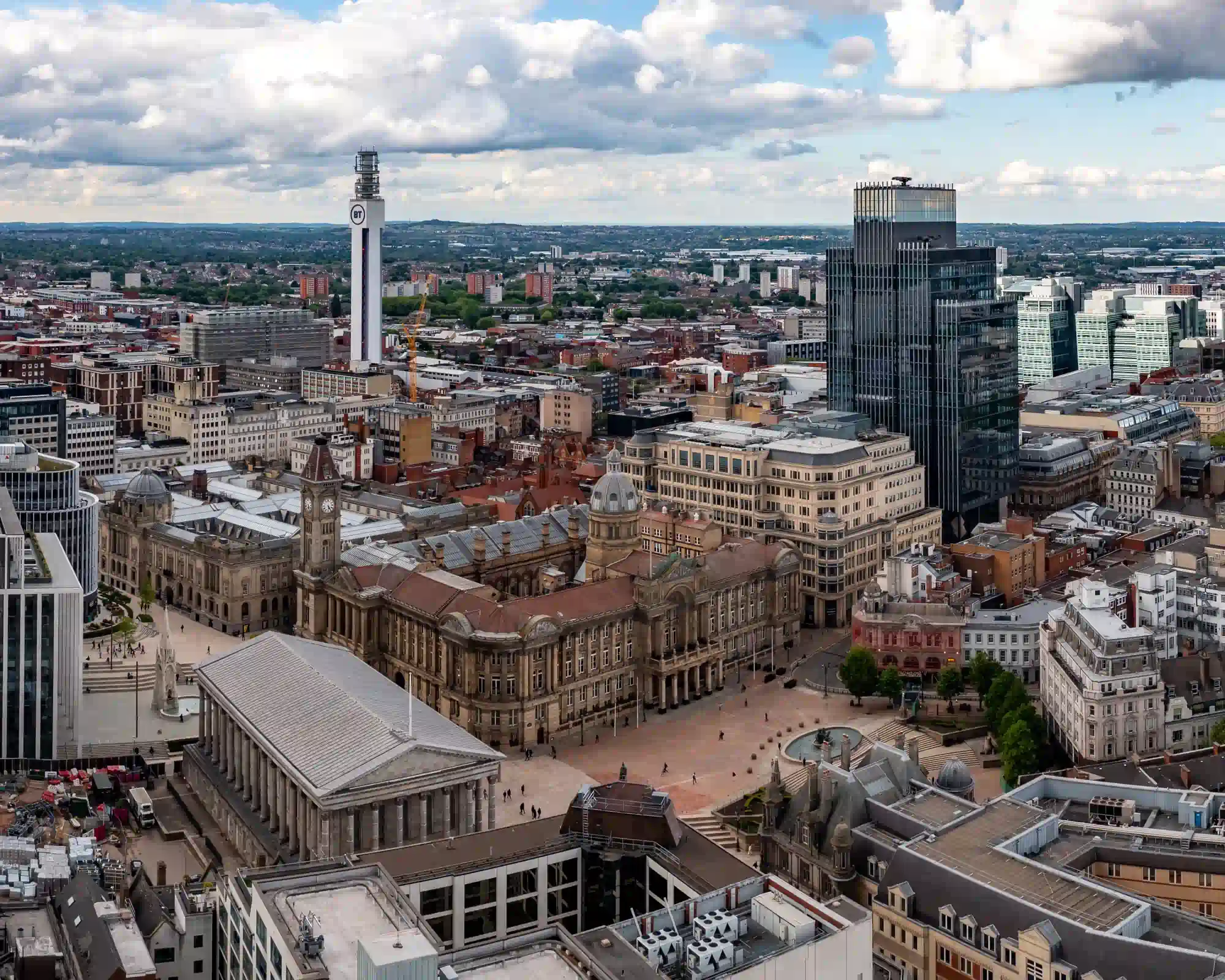 Aerial view of Birmingham city centre, with the Town Hall, Council House and Victoria Square in the foreground and the BT Tower rising above the skyline.