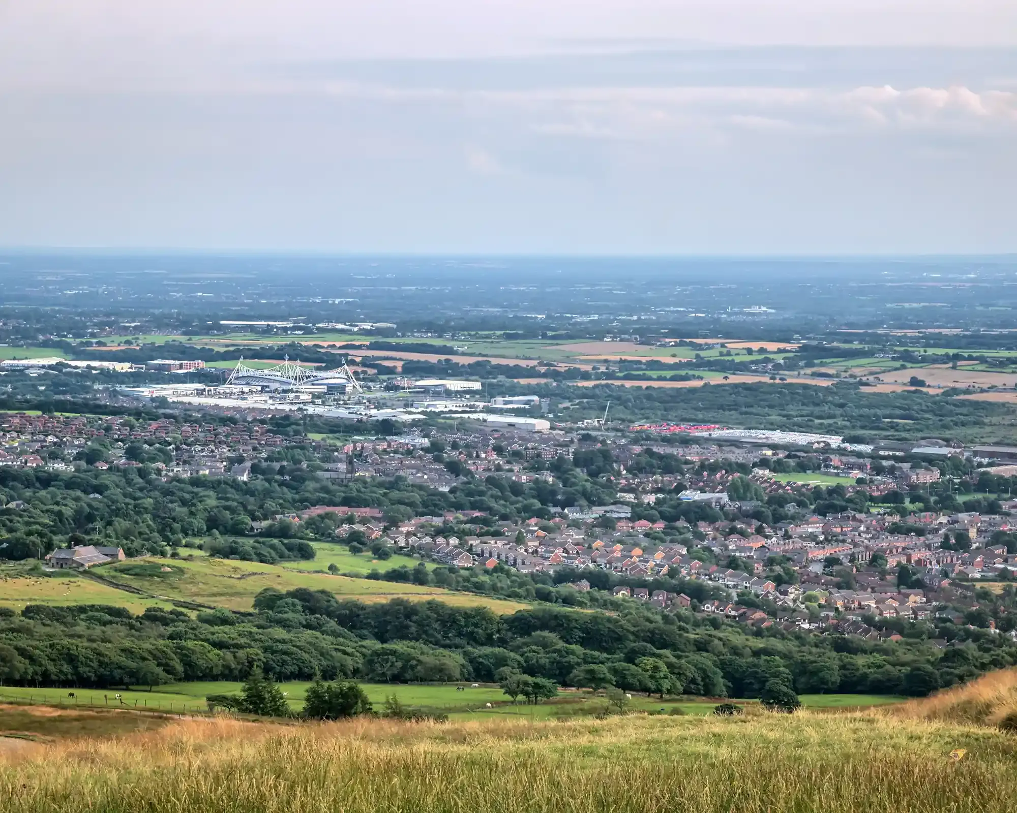 View from the West Pennine Moors over Horwich, near Bolton, with the town’s football stadium and the Lancashire plain beyond.