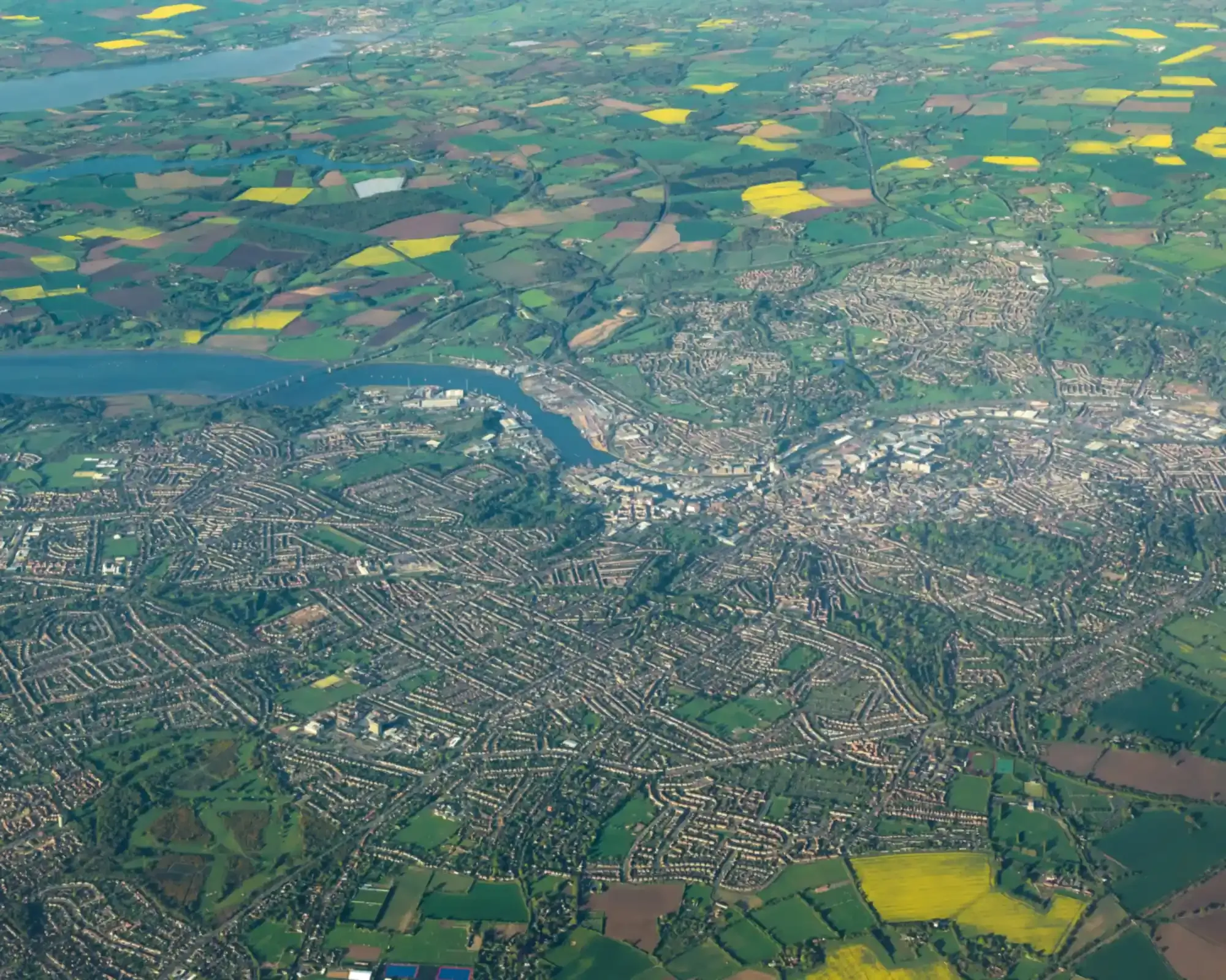 Aerial view of Ipswich and the River Orwell, with the Orwell Bridge and the Suffolk countryside beyond.